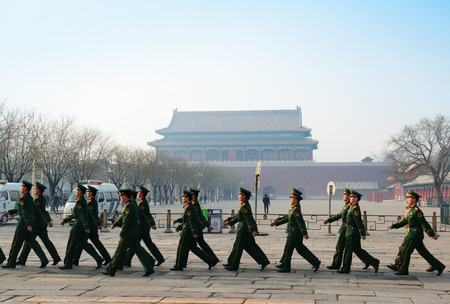 BEIJING, CHINA - APR 1: Team of soldier walk by Tiananmen in the morning on April 1, 2013 in Beijing, China. It is a famous monument in Beijing and serves as a national symbol.のeditorial素材