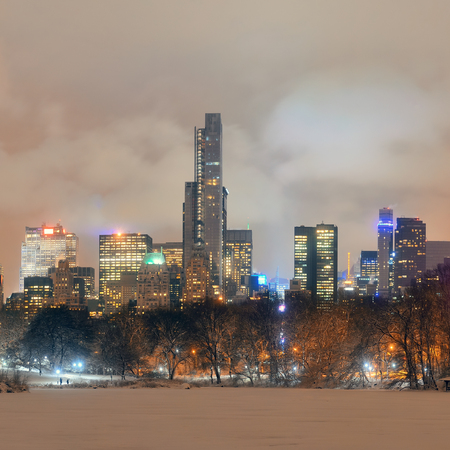 Central Park winter at night panorama with skyscrapers in midtown Manhattan New York Cityの写真素材