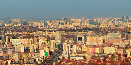 Beijing sunset aerial view with urban buildings.