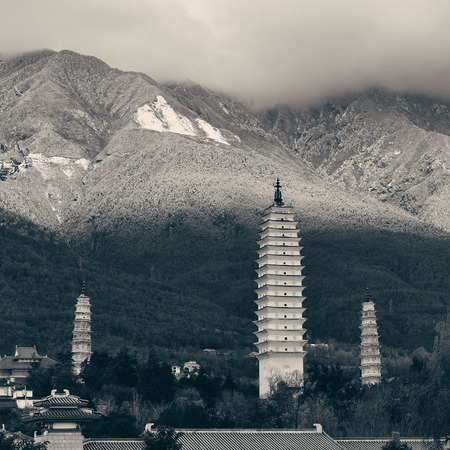 Ancient pagoda in Dali old town with snow capped Mt Cangshan, Yunnan, China.の写真素材