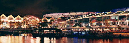 SINGAPORE - APR 5: Clarke Quay at night with street view and restaurant on April 5, 2013 in Singapore. As a historical riverside quay, it is now the hub of Singaporean nightclubs.のeditorial素材