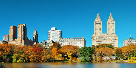 Central Park Autumn and midtown skyline over lake in Manhattan New York Cityの写真素材