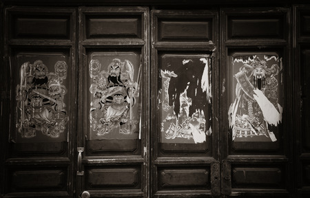 Door with decorations in old street in Lijiang, Yunnan, China.の写真素材