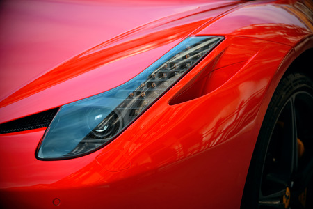 LONDON, UK - SEP 27: Red porsche in London Street closeup on September 27, 2013 in London, UK....