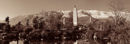 Ancient pagoda in Dali old town with snow capped Mt Cangshan, Yunnan, China.の写真素材