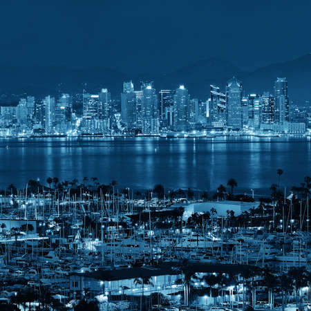 San Diego downtown skyline at night with boat in harbor.の写真素材