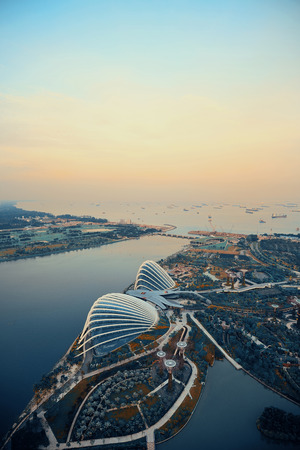 Singapore rooftop view with urban skyscrapers at sunset.のeditorial素材