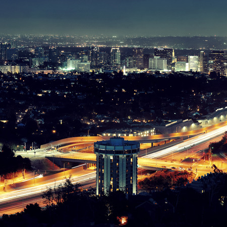 Los Angeles at night with urban buildings and highwayの写真素材