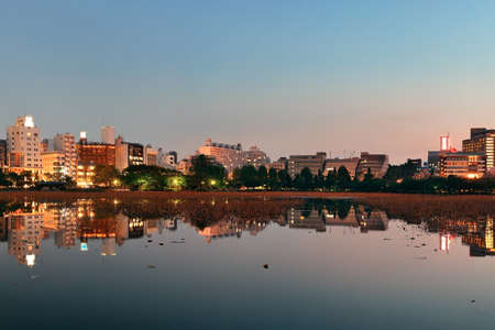 Ueno park in Tokyo at night with lake reflection, Japan.の写真素材