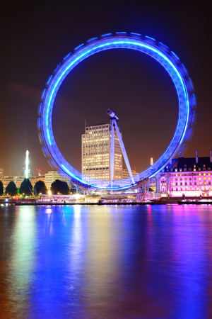 LONDON, UK - SEP 26: London Eye over Thames River on September 26, 2013 in London, UK. It is Europe's tallest Ferris wheel and the most popular paid tourist attraction in UKのeditorial素材