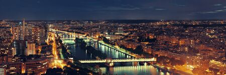 Paris city skyline rooftop view with River Seine at night, France.の写真素材