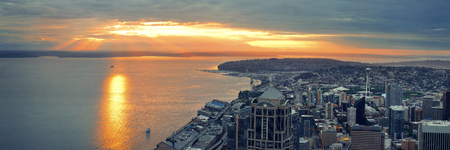 Seattle rooftop panorama view with urban architecture at sunset.の写真素材
