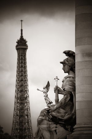 Statue of Alexandre III bridge over River Seine with Eiffel Tower in Paris, France.の写真素材