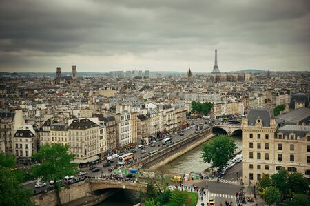 PARIS, FRANCE - MAY 13: Rooftop view with street and Eiffel tower on May 13, 2015 in Paris. With the population of 2M, Paris is the capital and most-populous city of France.のeditorial素材
