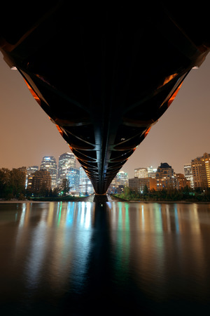 CALGARY, CANADA - AUGUST 27: Peace Bridge at night on August 27, 2015 in Calgary, Canada. Designed by Santiago Calatrava, the pedestrian bridge connect across Bow River and the landmark of the city.のeditorial素材