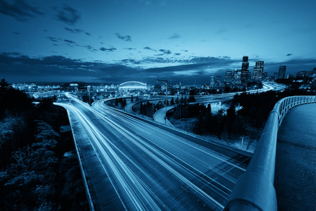 Seattle city view with urban architecture and traffic light trail at dusk.の写真素材