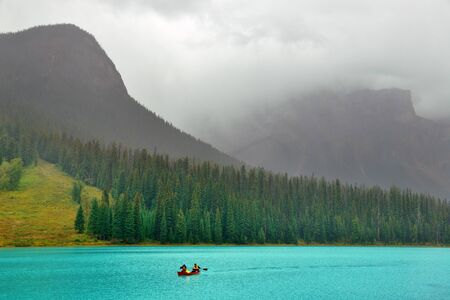 Emerald lake with fog in Yoho National Park, Canada.