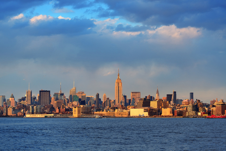 Downtown Manhattan skyline at sunset over Hudson River in New York Cityの写真素材