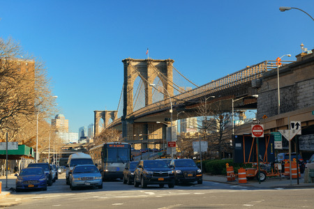 NEW YORK CITY - APR 1: Downtown Manhattan street view with Brooklyn Bridge on April 1, 2015 in Manhattan, New York City. With population of 8.4M, it is the most populous city in the United States.のeditorial素材