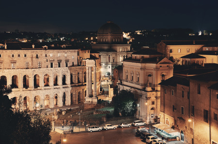Rome rooftop view with street and ancient architecture in Italy at night.の写真素材