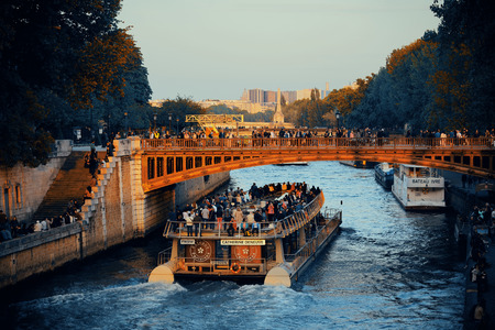 PARIS, FRANCE - MAY 13: Historical architecture and River Seine at sunset on May 13, 2015 in Paris. With the population of 2M, Paris is the capital and most-populous city of Franceのeditorial素材