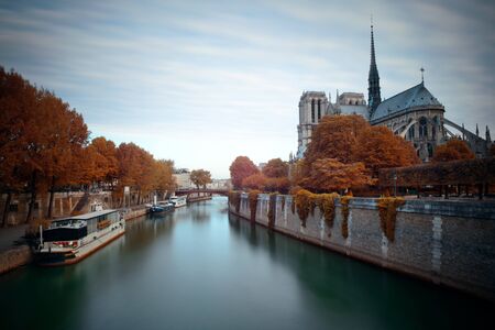 Paris River Seine with Notre-Dame cathedral and boat in France.の写真素材