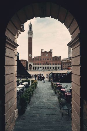 City Hall Bell Tower viewed from archway in Siena Italy.のeditorial素材