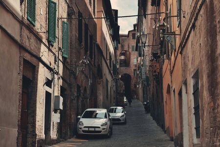 Street view with old buildings in Siena, Italy.の写真素材