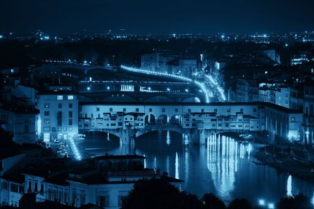 Florence skyline viewed from Piazzale Michelangelo at night with Ponte Vecchioの写真素材