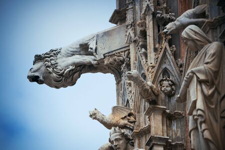 Siena Cathedral gargoyle closeup as the famous landmark in medieval town in Italy.の写真素材