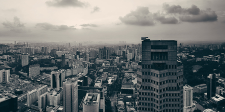 Singapore rooftop view with urban skyscrapers at sunset.の写真素材