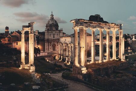Rome Forum with ruins of ancient architecture at night. Italy.の写真素材