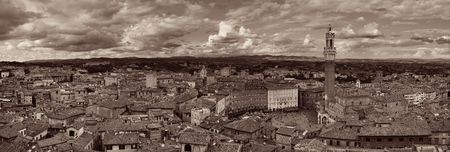Medieval town Siena skyline view with historic buildings and Town Hall Bell Tower in Italyの写真素材