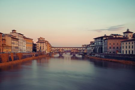 Ponte Vecchio over Arno River in Florence Italy at sunriseの写真素材