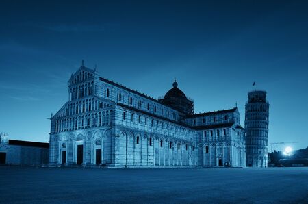 Leaning tower and cathedral at night in Pisa, Italy as the worldwide known landmark.の写真素材