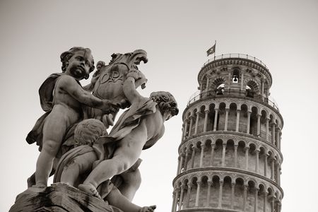 Leaning tower and fountain sculpture in Pisa, Italy as the worldwide known landmark.の写真素材
