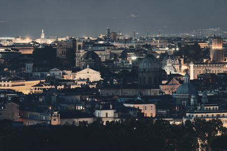 Rome rooftop view with ancient architecture in Italy at night.の写真素材