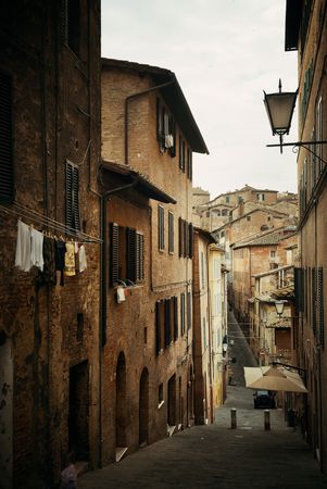 Street view with old buildings in Siena, Italy.の写真素材