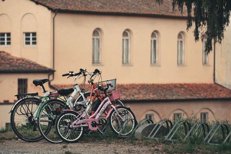 LUCCA - MAY 19: Bikes with old church on May 19, 2016 in Lucca, Italy. It is famous for its well preserved Renaissance-era city walls and the tourism location.のeditorial素材