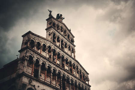 The Church of San Pietro Somaldi and Campanile facade closeup in Lucca Italyの写真素材