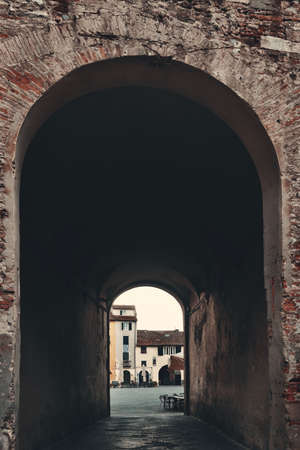 Lucca street view with archway in Italyの写真素材