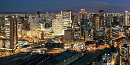 Osaka urban city at night panorama rooftop view. Japan.の写真素材