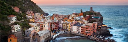Vernazza with buildings on rocks over sea panorama view in Cinque Terre, Italy.の写真素材