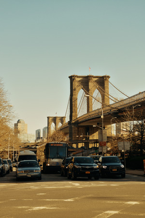 NEW YORK CITY - APR 1: Downtown Manhattan street view with Brooklyn Bridge on April 1, 2015 in Manhattan, New York City. With population of 8.4M, it is the most populous city in the United States.のeditorial素材
