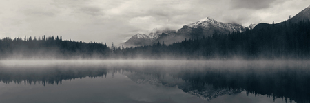 Lake Herbert panorama in a foggy morning with glaciers mountain and reflection in Banff National Park, Canadaの写真素材