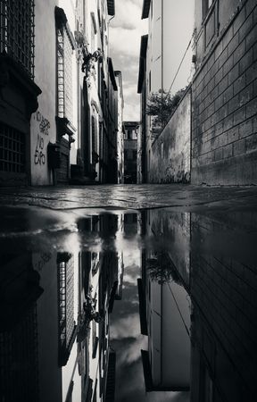 Lucca street view with water reflection after rain in Italyの写真素材