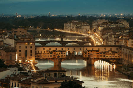 Florence skyline viewed from Piazzale Michelangelo at night with Ponte Vecchioの写真素材