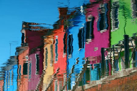 Reflection of Burano colorful historical buildings. Venice, Italy.の写真素材