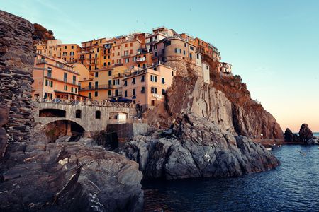 Manarola overlook Mediterranean Sea with buildings over cliff in Cinque Terre, Italy.の写真素材