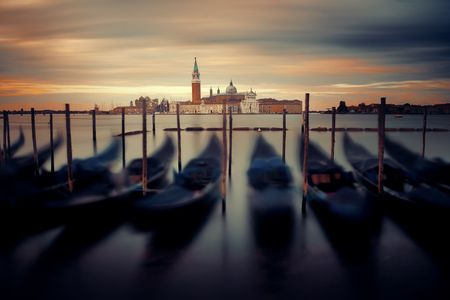 Gondola park in water and San Giorgio Maggiore island in Venice at sunrise, Italy.の写真素材